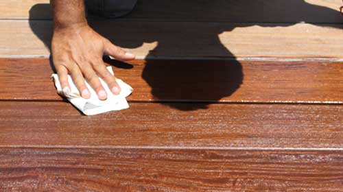 Wipe excess oil from your deck